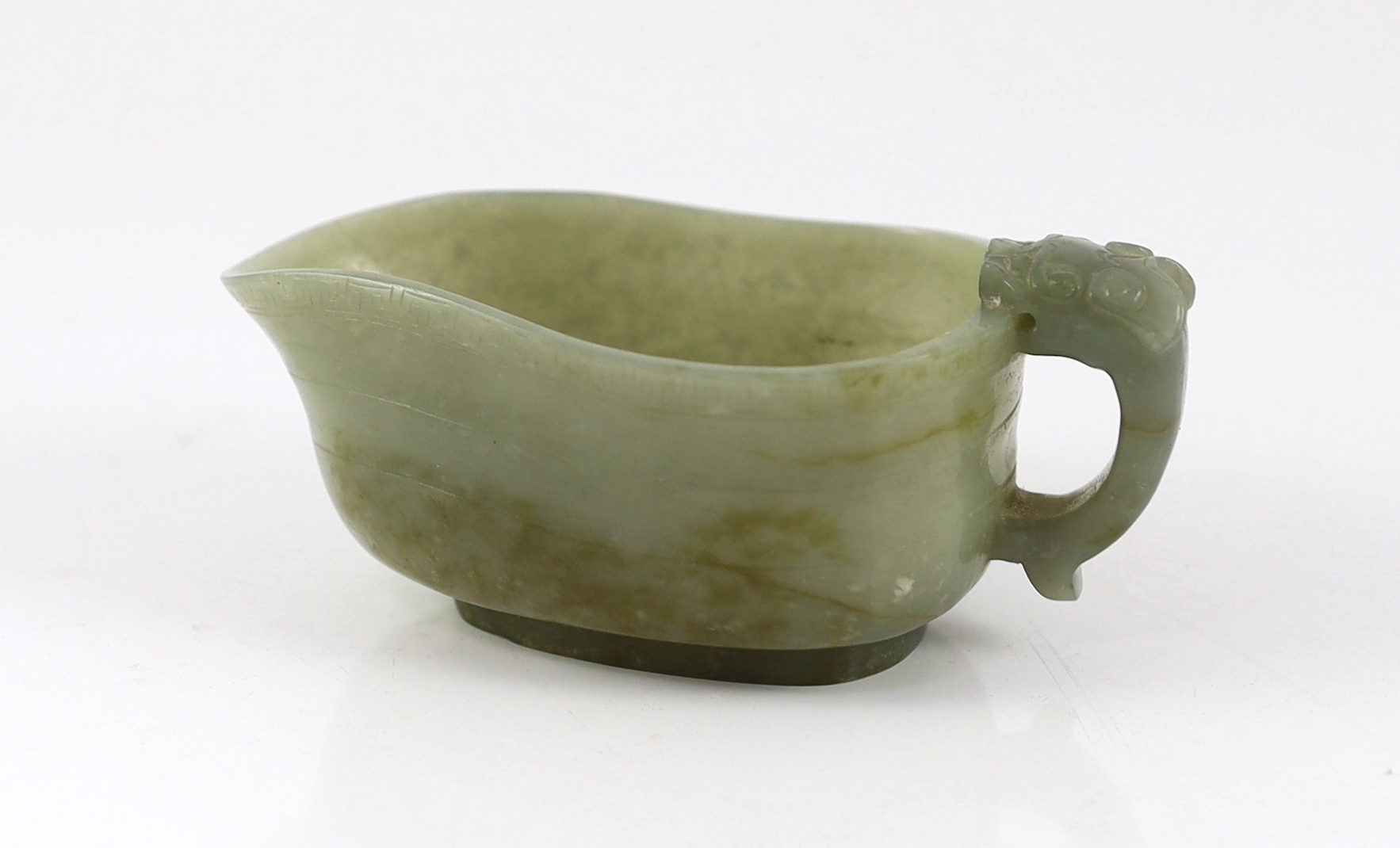 A Chinese celadon jade pouring vessel, yi, 17th/18th century